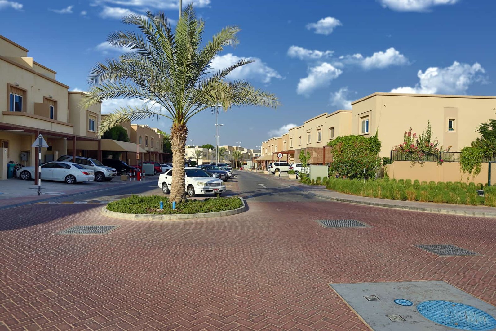 Front exterior view of Desert Villas at Al Reef Island Abu Dhabi showing modern architecture and landscaped gardens.