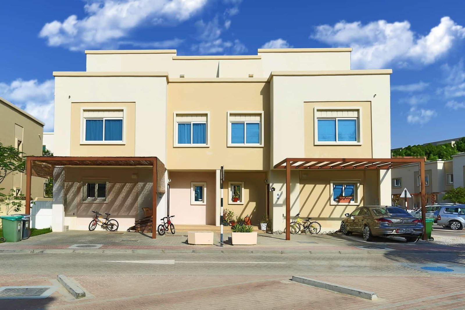 Community amenities at Al Reef Villas Abu Dhabi, including swimming pools, kids’ play areas, and fitness facilities.